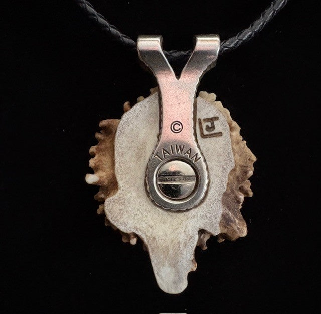 Back view of deer antler horse head in laid on a black background
