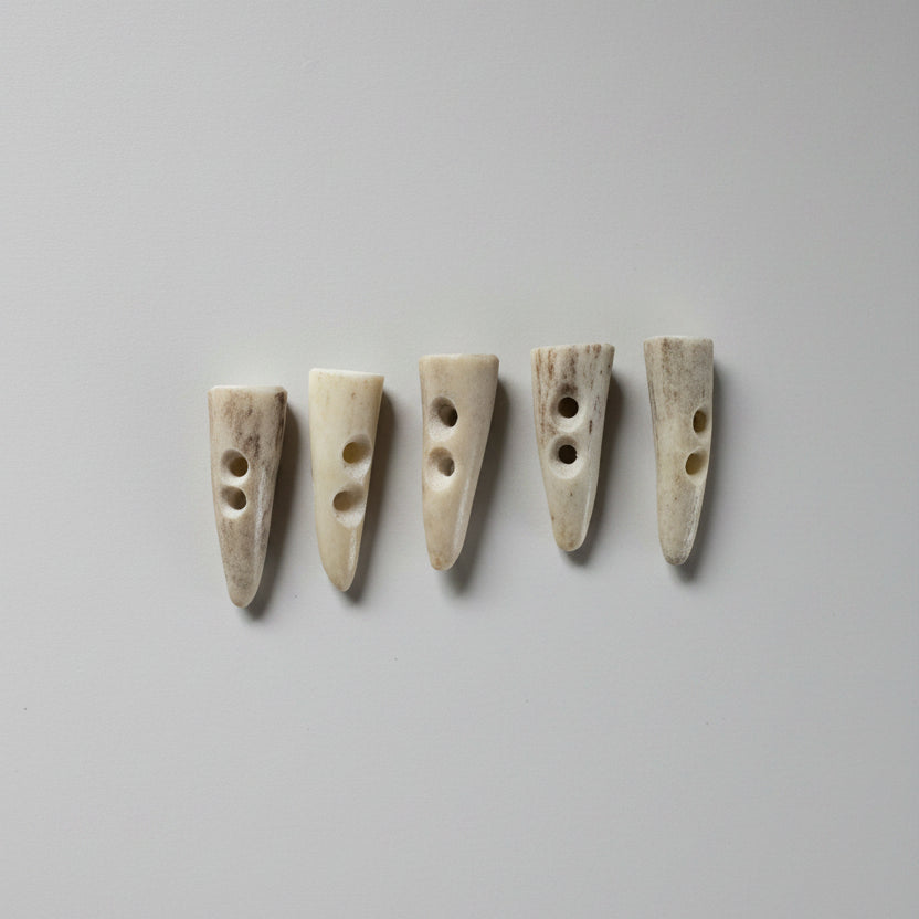 5 deer antler toggle buttons around 1 inch long on a gray background