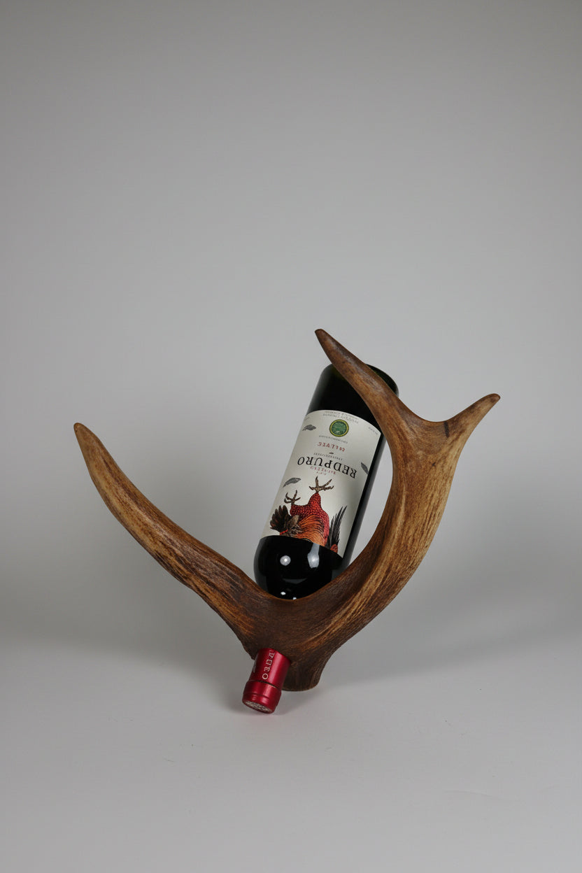 elk antler bottle holder on a gray background
