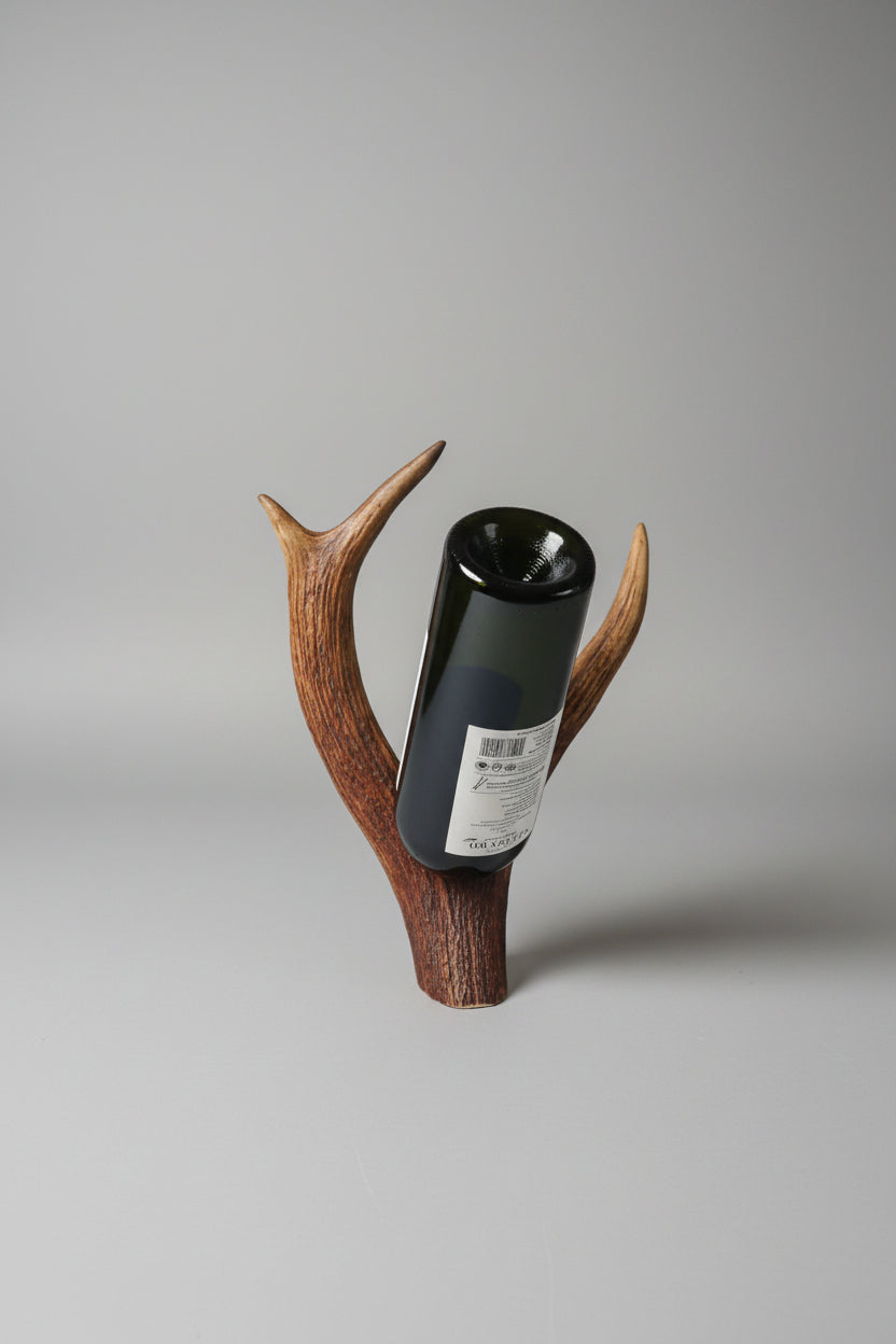 elk antler bottle holder on a gray background