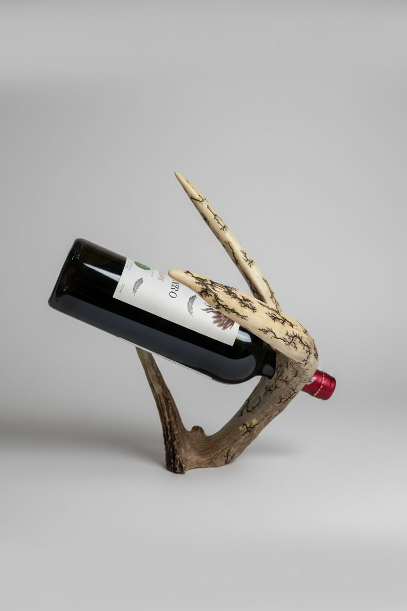 Mule deer antler bottle holder on a gray background