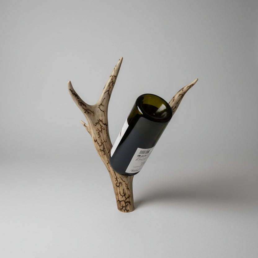 Mule deer antler bottle holder on a gray background