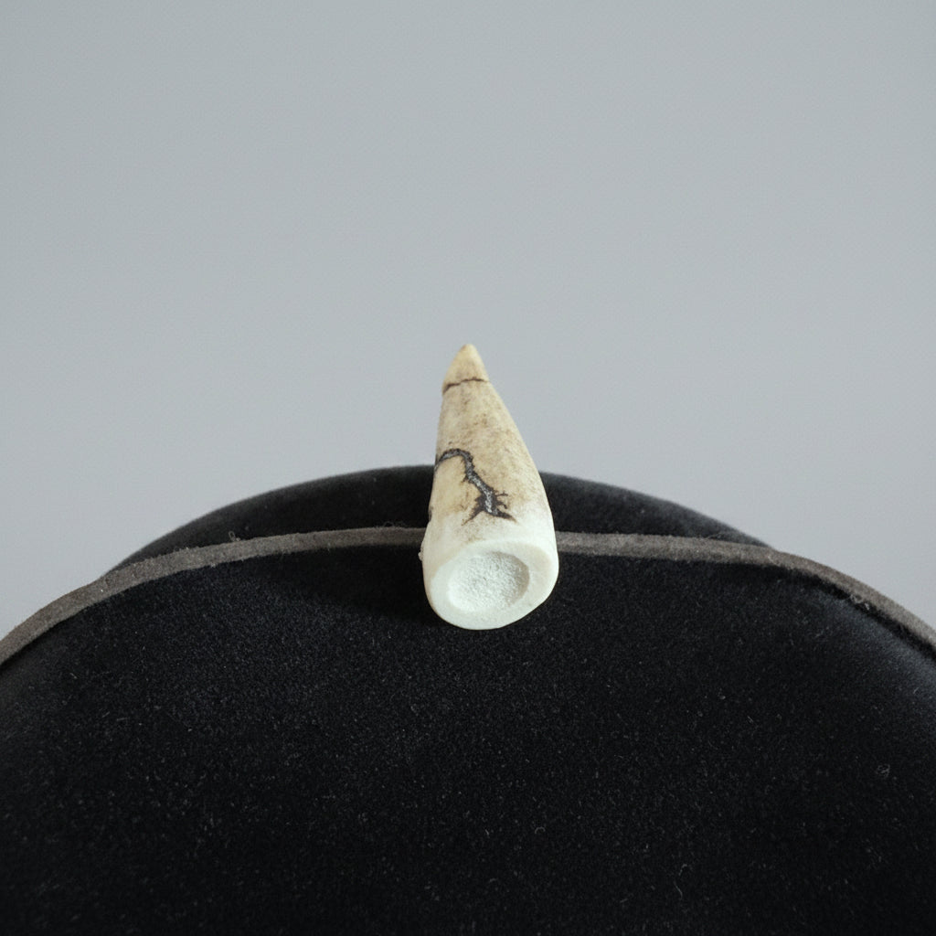 top view of the Deer antler tip necklace with aroma diffuser on a gray background 