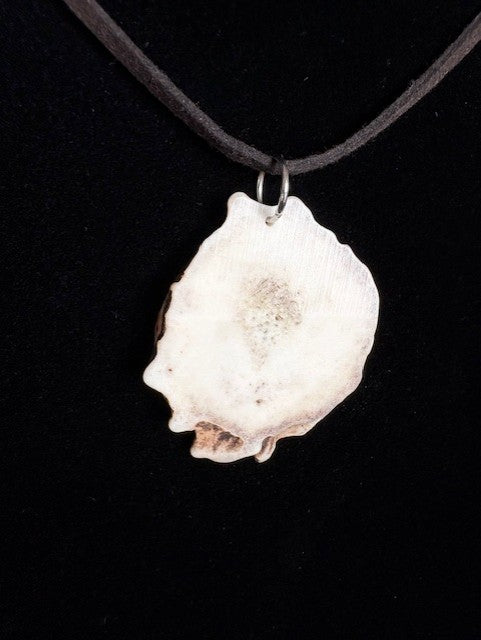 Back view of Necklace with a pendant featuring feather design on a black background