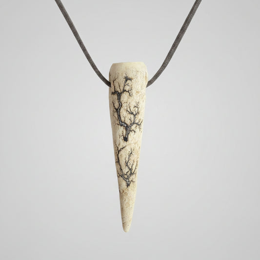 Deer antler tip necklace with aroma diffuser on a gray background 