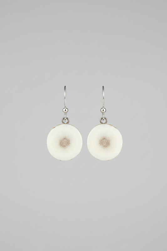 Natural deer antler earrings on a gray background