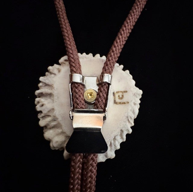 back view of the Bolo tie on a black background