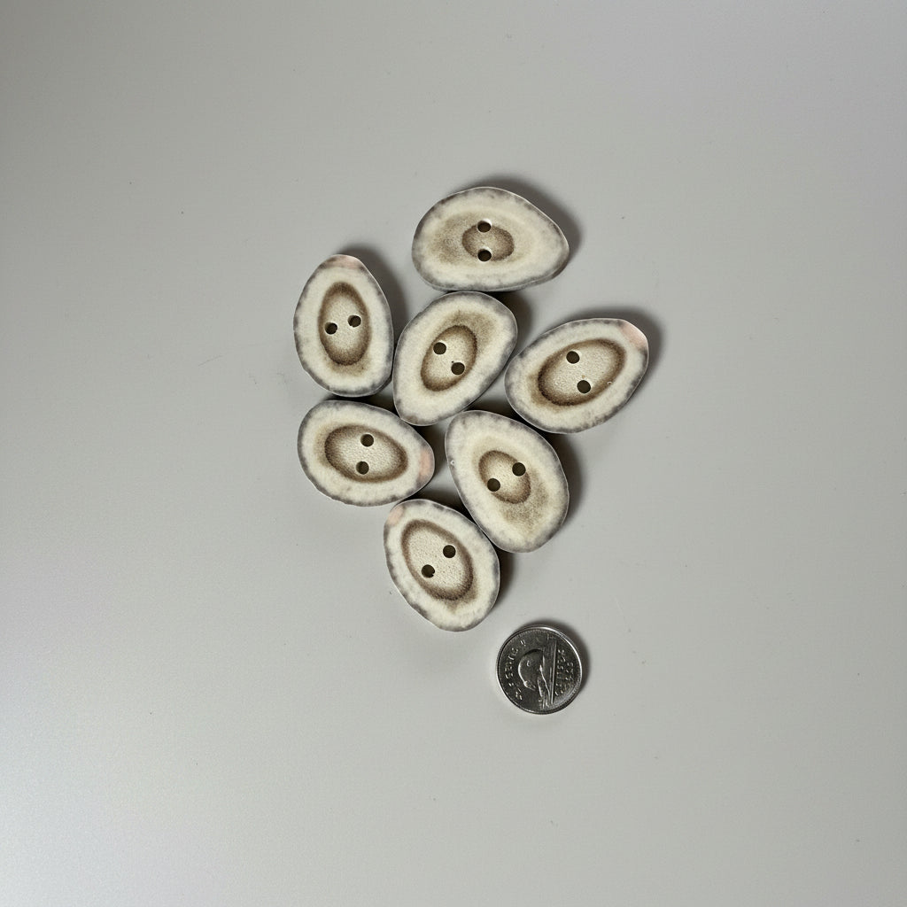 Deer antler buttons on a gray background