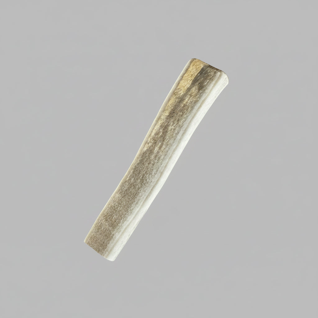 4 inches deer antler dog chew split on a gray background