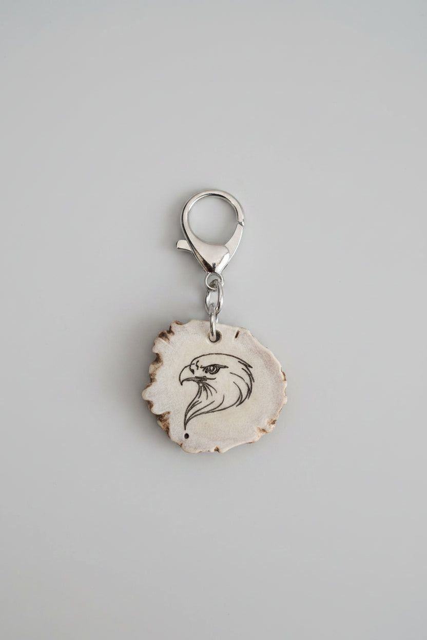 Silver keychain with eagle design on a piece of deer antler
