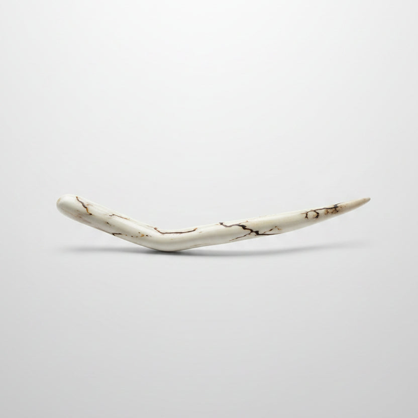 Deer antler hair pin with black strike on a gray background