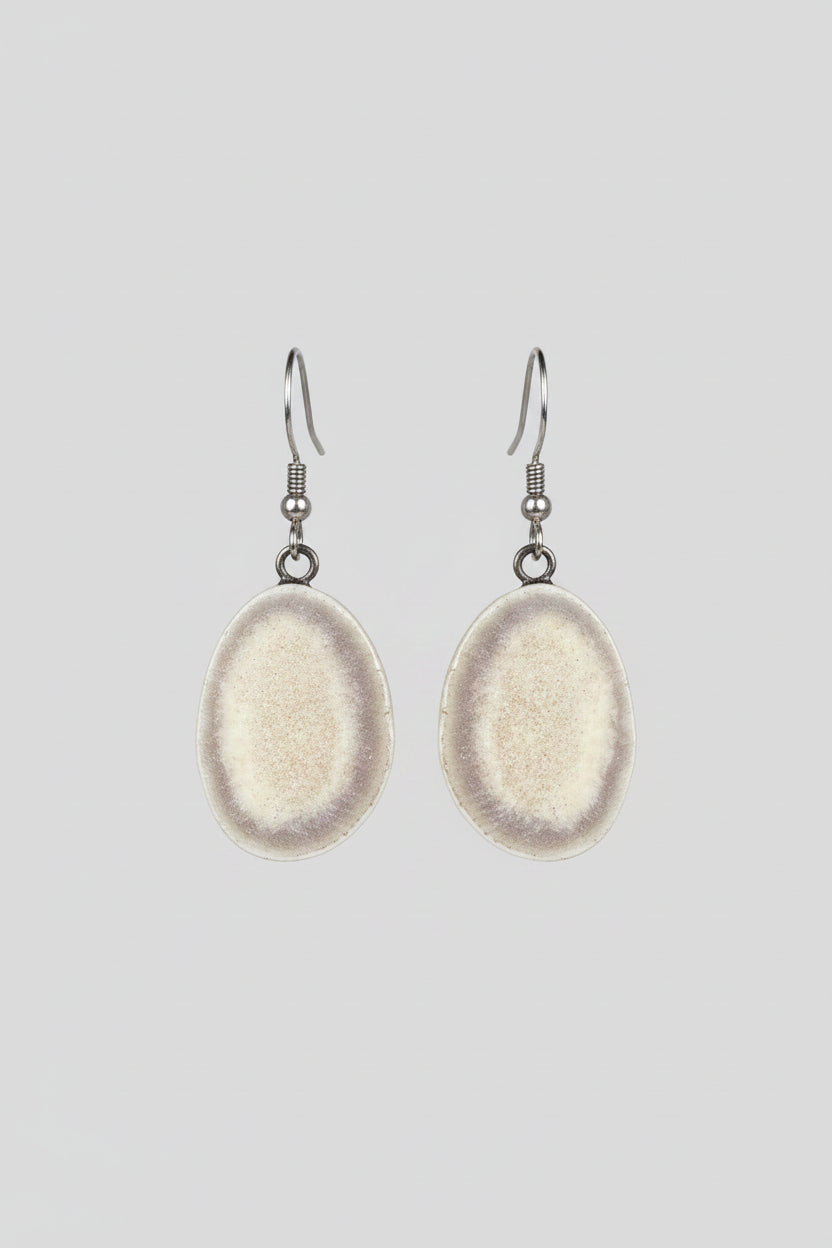 Deer antler earrings on a gray background