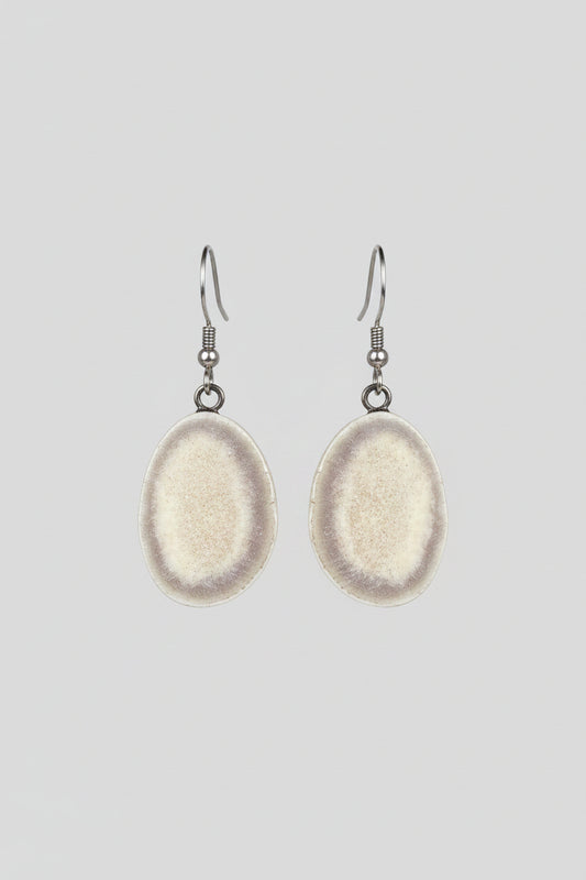 Deer antler earrings on a gray background