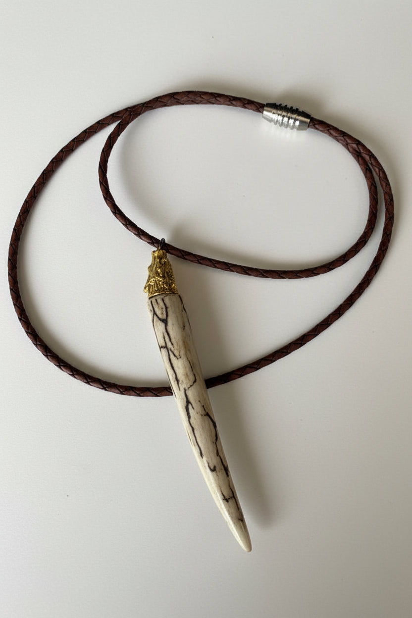 Necklace with a unique pendant on a plain background