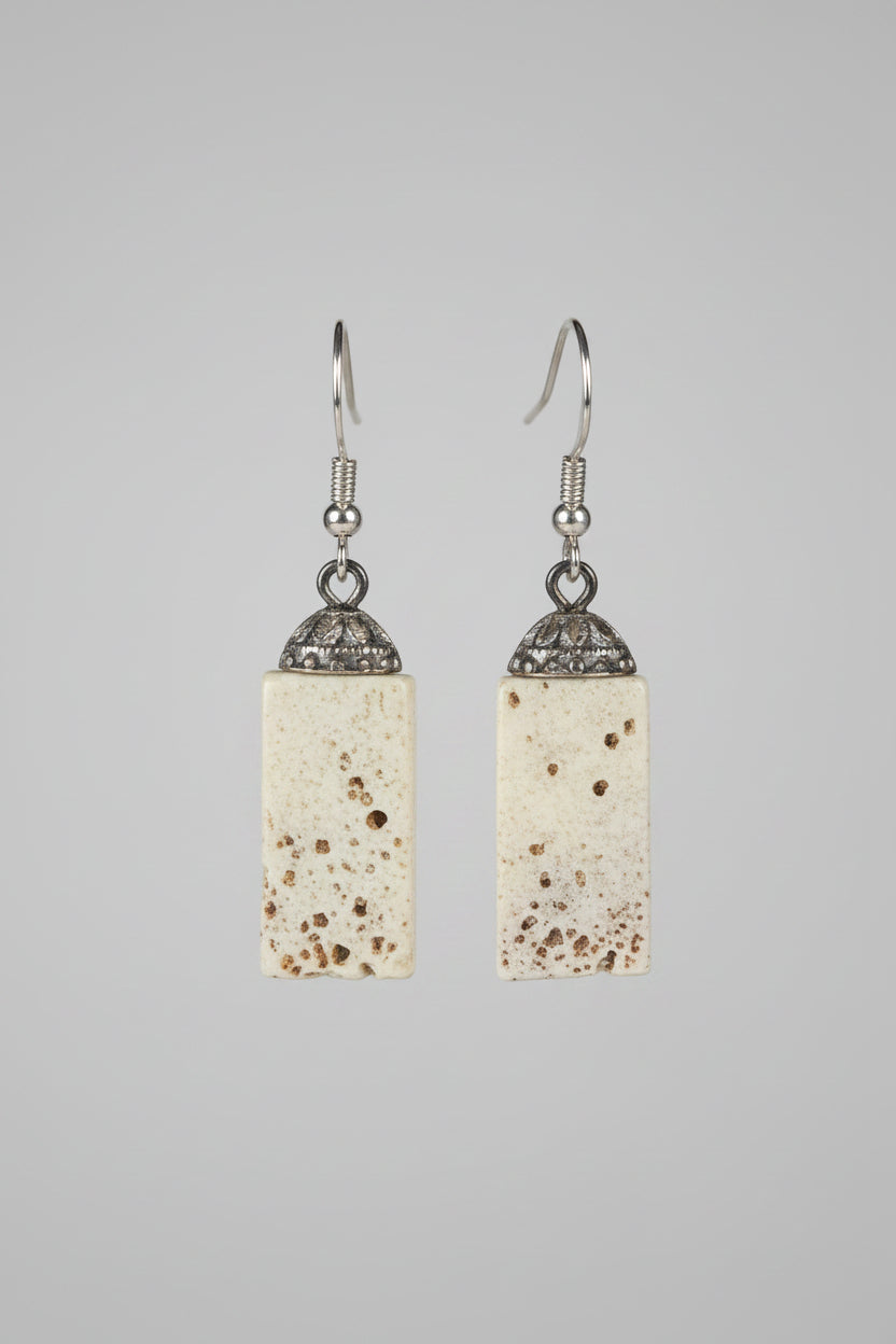 Elk earrings on a gray background