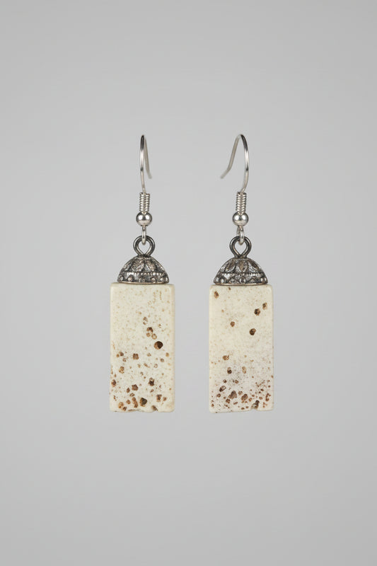 Elk earrings on a gray background