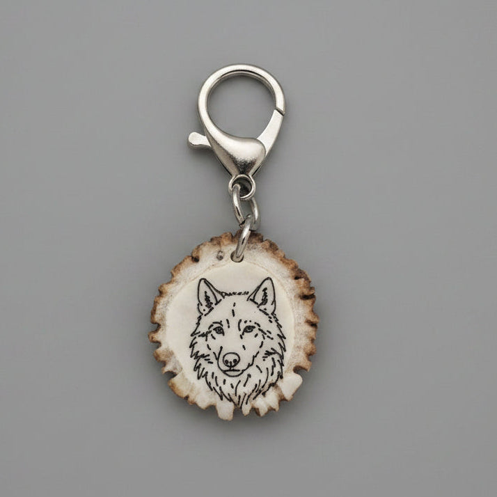 Engraved wolf on a piece of deer antler keychain